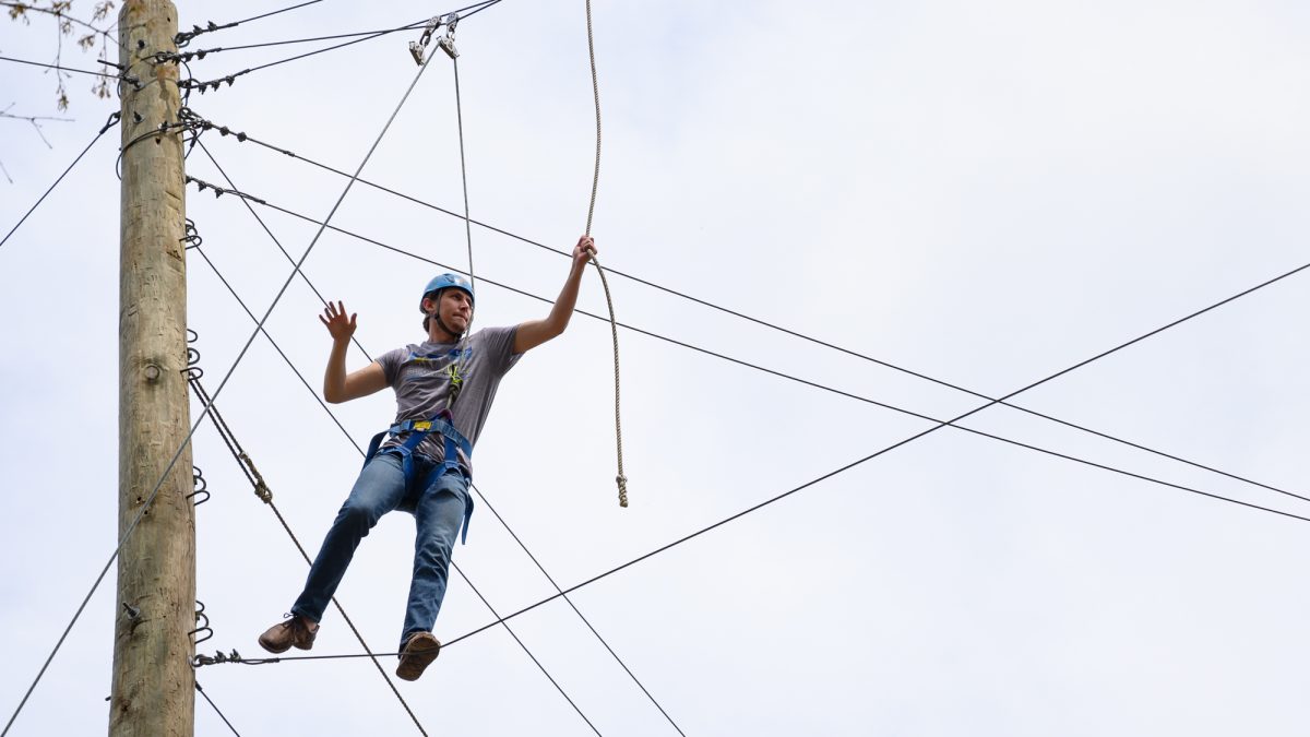 Visitor climbing our rope course