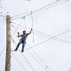 Visitor climbing our rope course