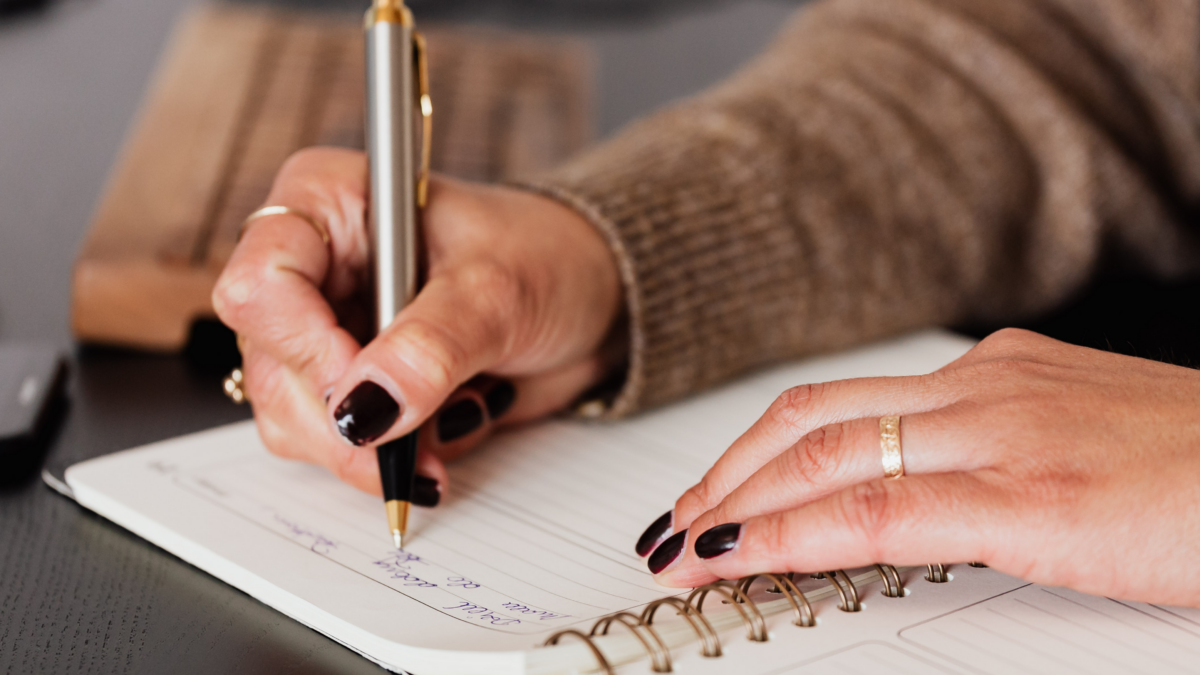 a woman journaling for therapy - 12 journal prompts from a family therapist at Capstone Treatment Center