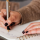 a woman journaling for therapy - 12 journal prompts from a family therapist at Capstone Treatment Center