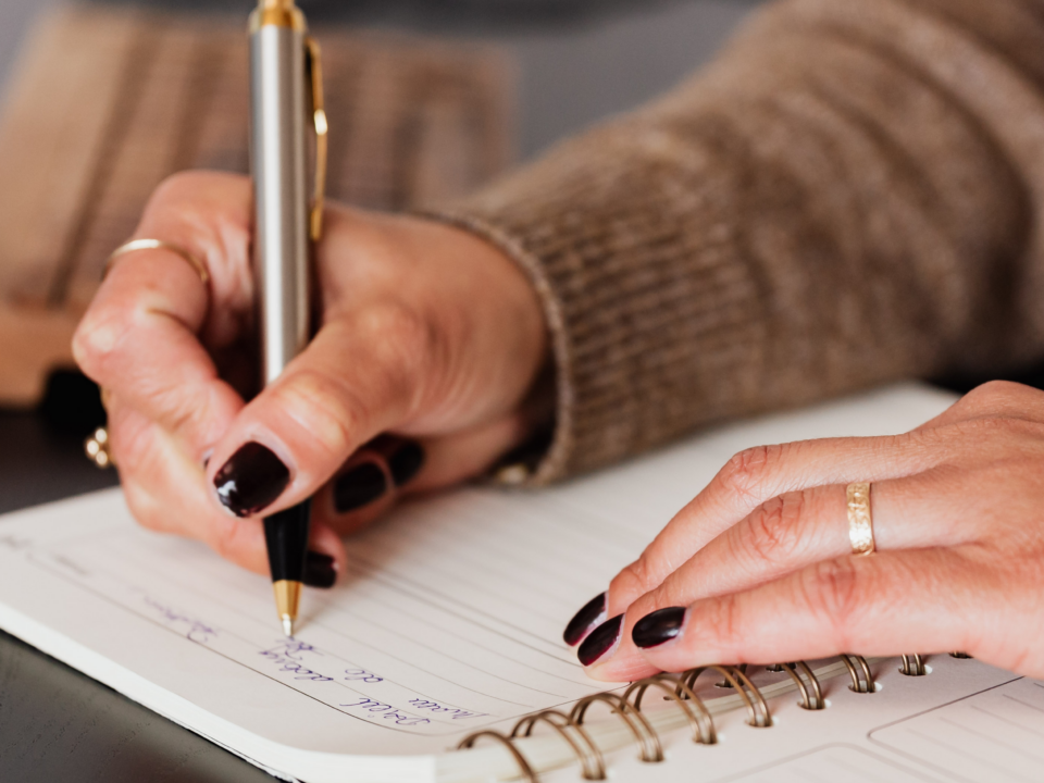 a woman journaling for therapy - 12 journal prompts from a family therapist at Capstone Treatment Center